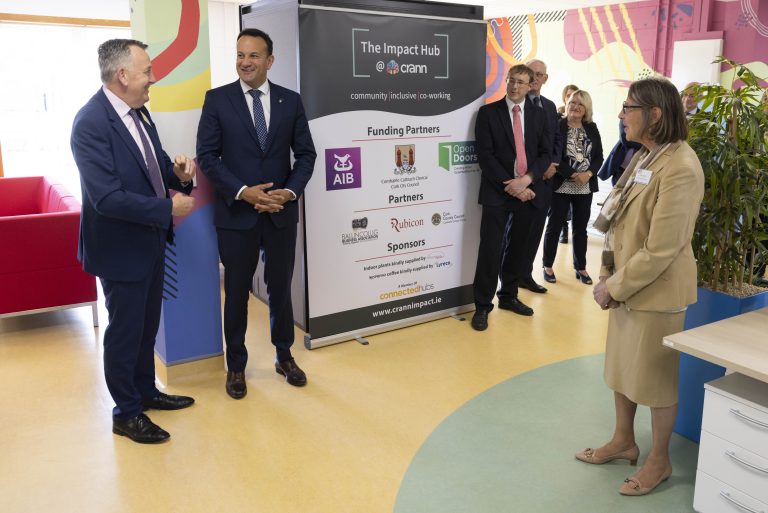 11An Tánaiste, Leo Varadkar is picture at The Impact Hub in front of a banner with funding partner logos. Also pictured are Padraig Mallon, Kate Jarvey and representatives from Impact Hub partners.
